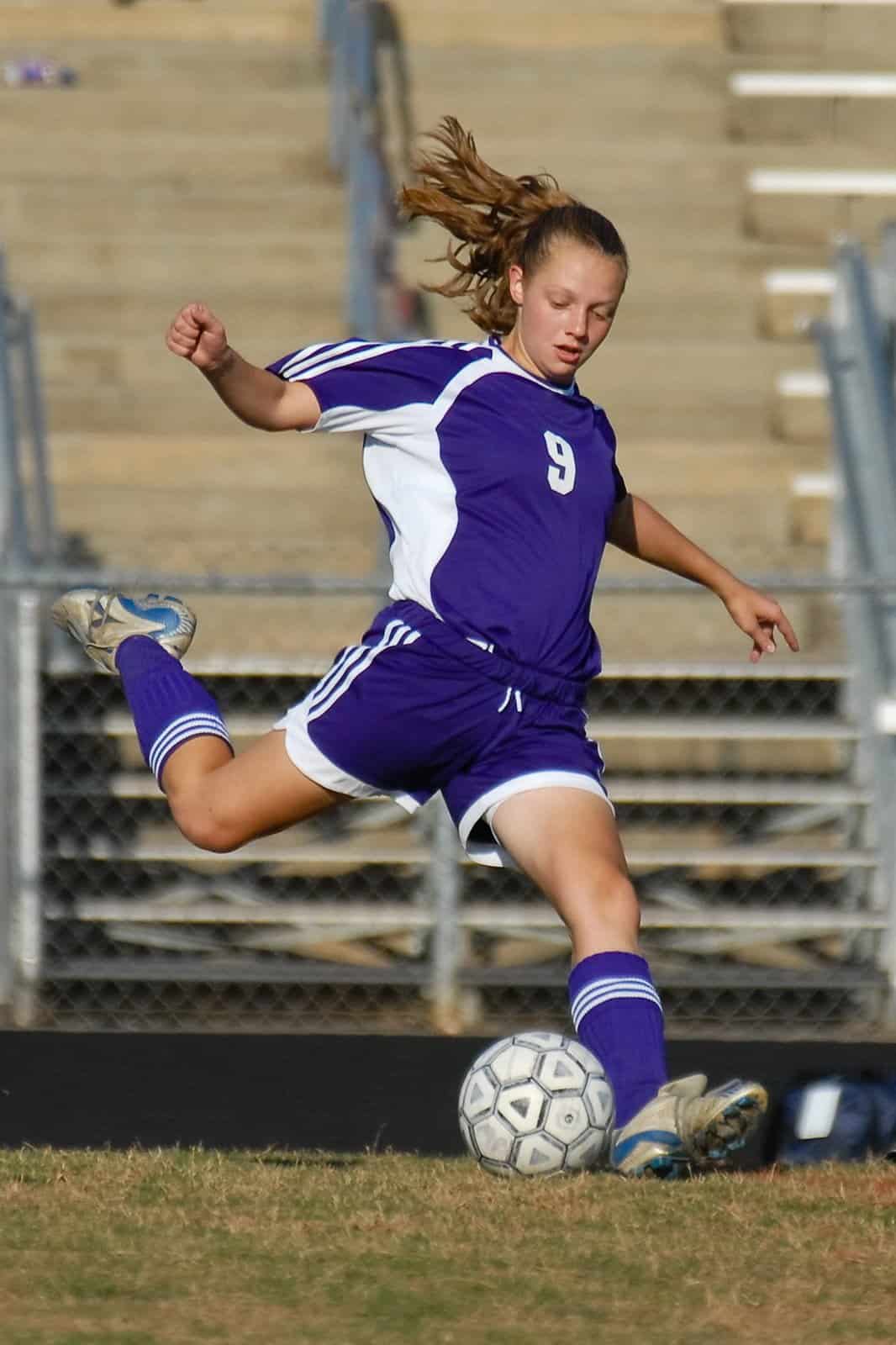 Teen playing soccer